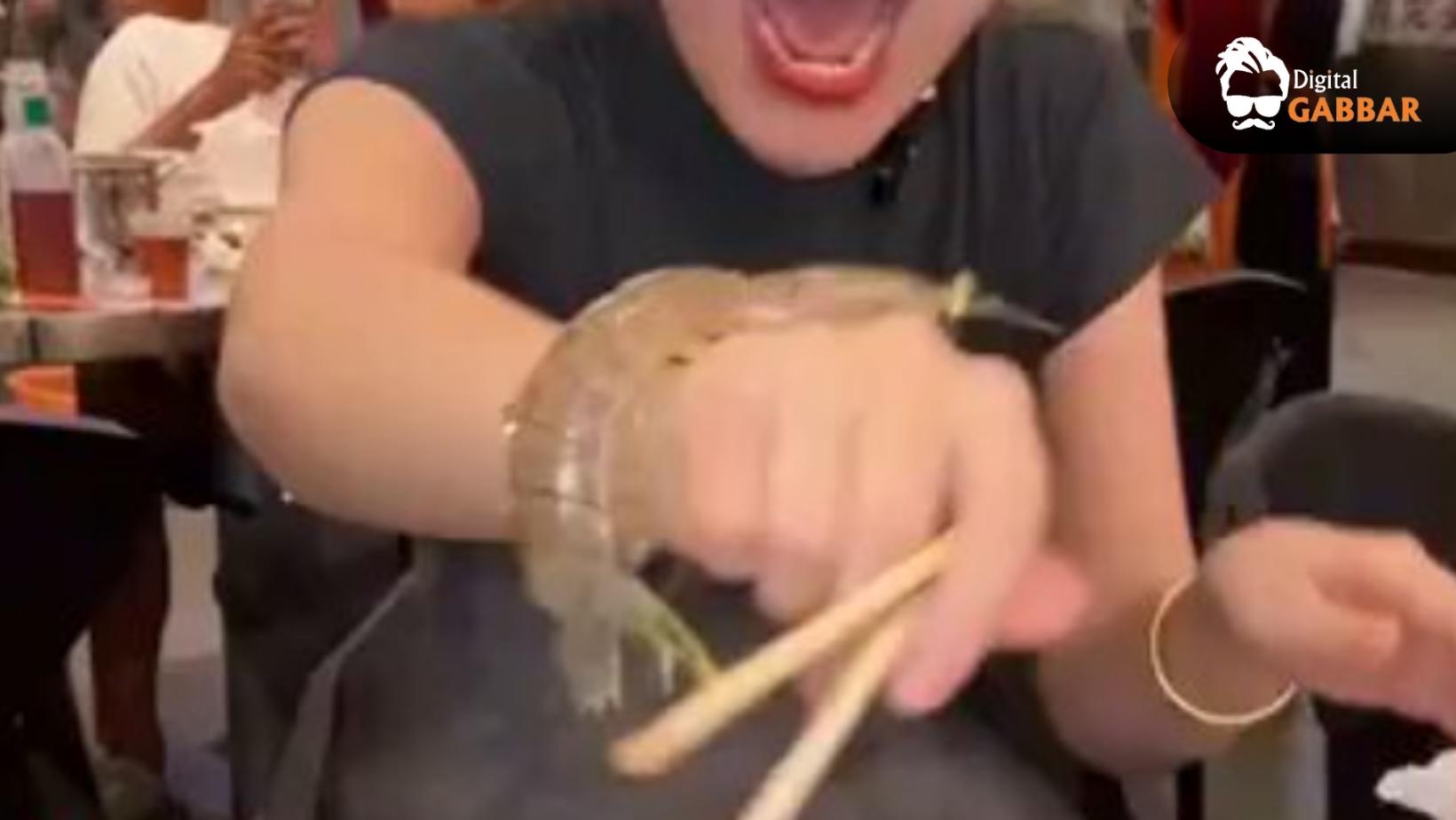 Chinese Woman Tries Eating Live Shrimp, Ends Up Screaming as It Attacks Her Hand 92 Chinese Woman Live Shrimp Attack Viral Video